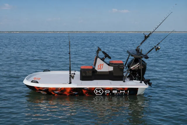 KOSHI 11 fishing skiff on flat water, rigged with rods and a Mercury outboard